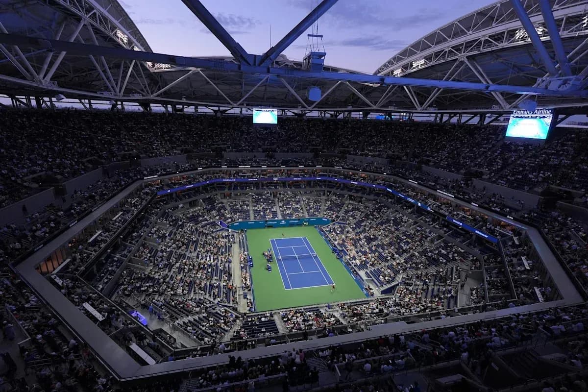 View of packed stadium during night tennis match View of packed stadium during night tennis match