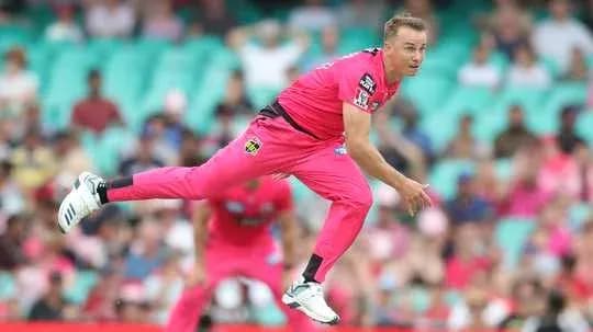 Bowler delivering a ball in a cricket match Bowler delivering a ball in a cricket match