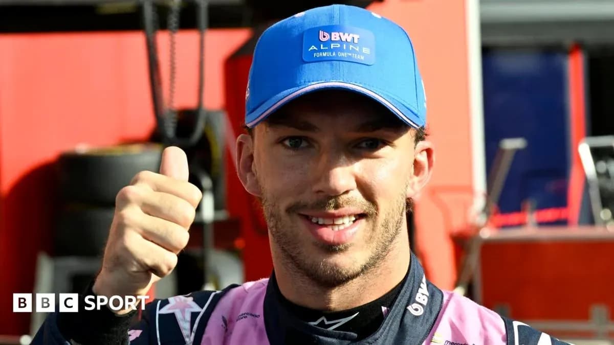 Driver giving thumbs up in team attire Driver giving thumbs up in team attire