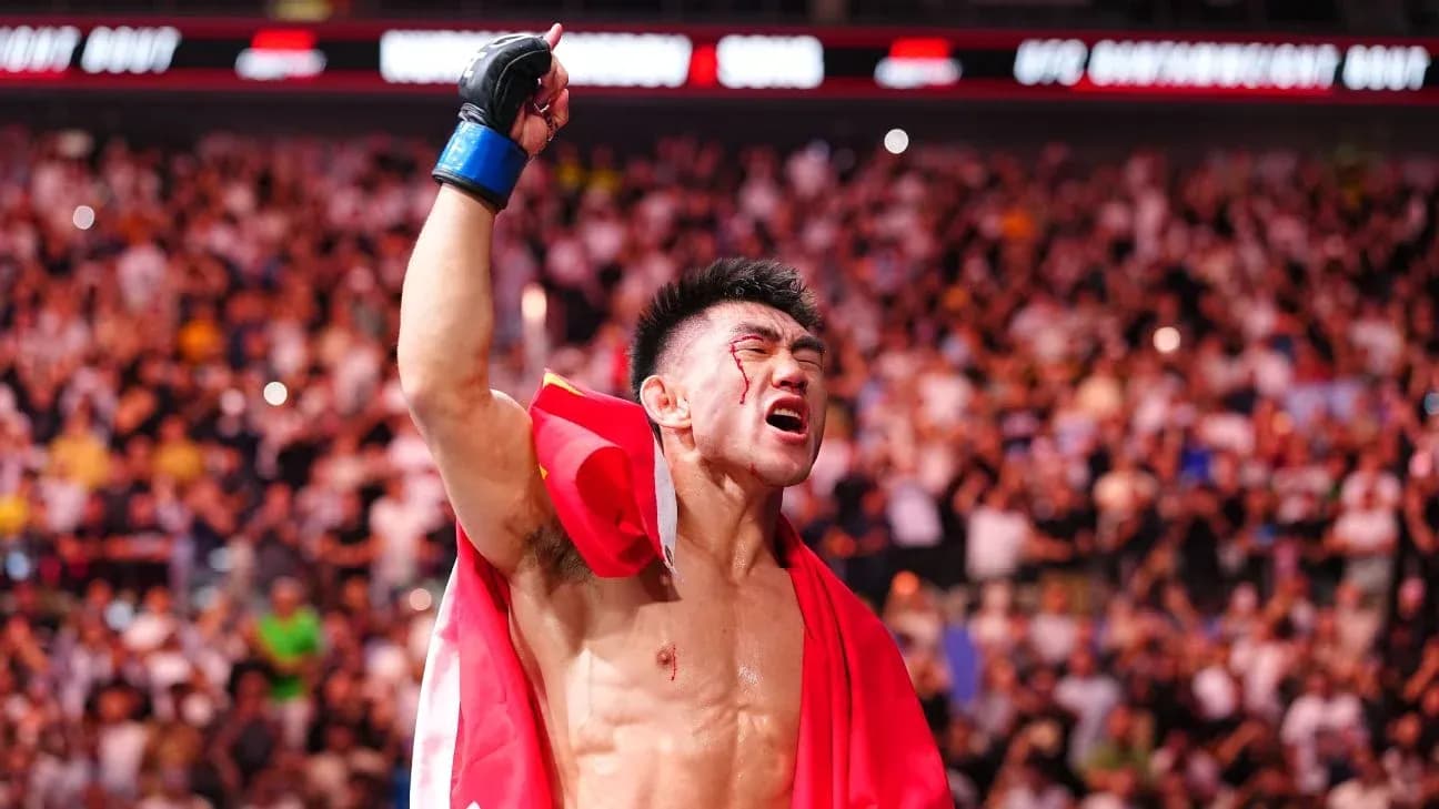 Fighter celebrating with a flag after victory Fighter celebrating with a flag after victory