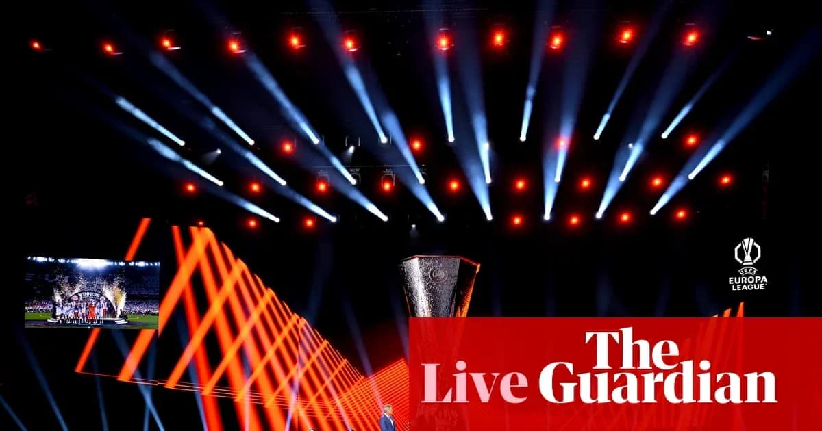Europa League trophy displayed with stage lighting Europa League trophy displayed with stage lighting