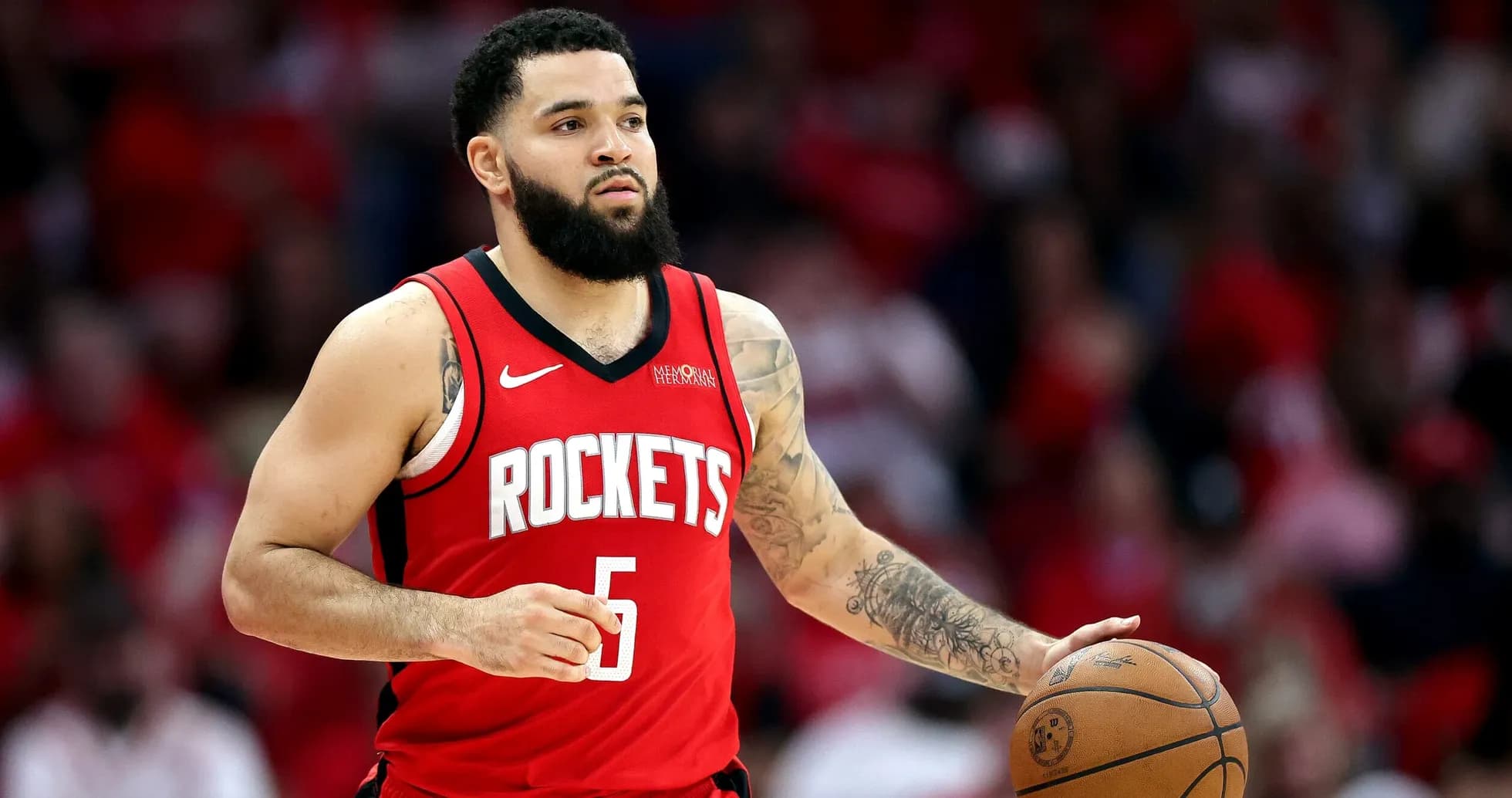 Player dribbling basketball during game for Rockets Player dribbling basketball during game for Rockets