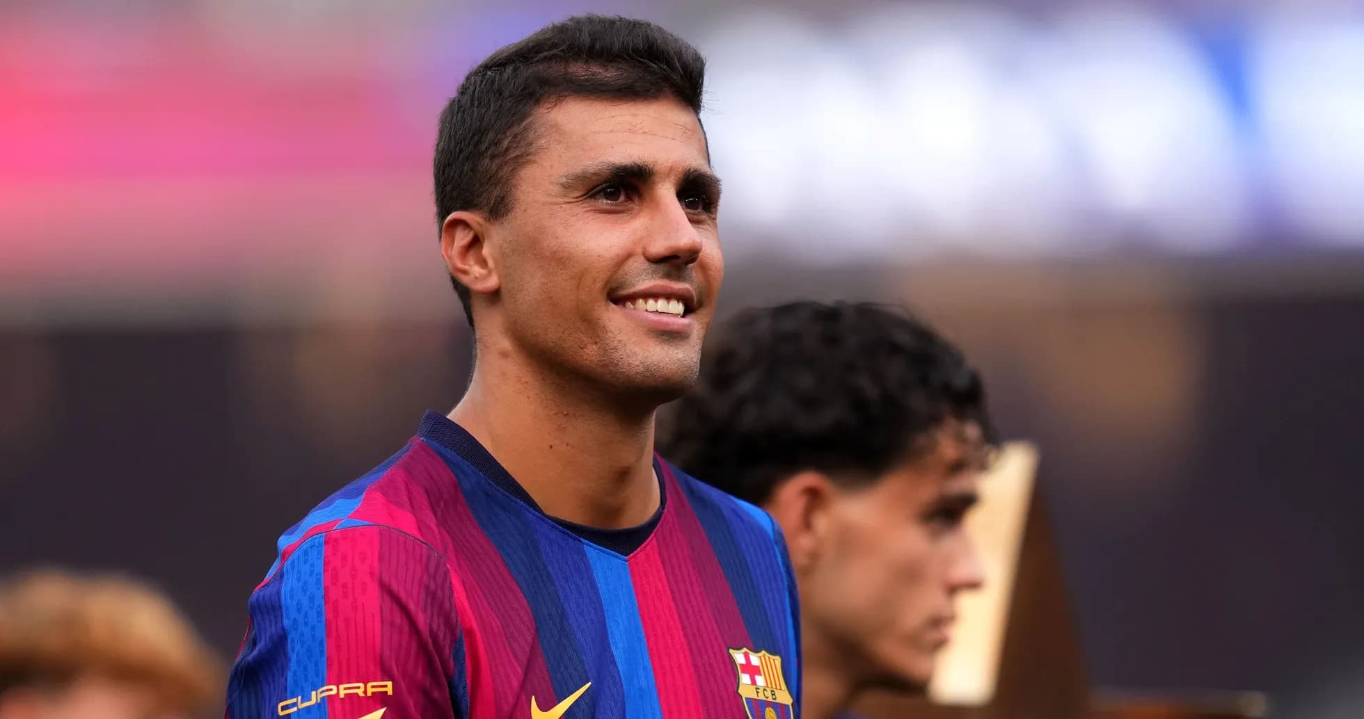 Player in FC Barcelona jersey smiling during celebration Player in FC Barcelona jersey smiling during celebration
