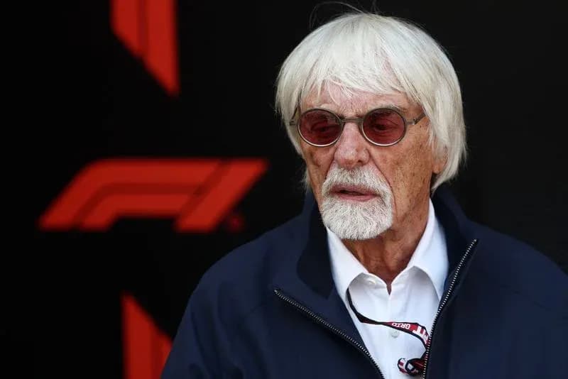 Man with white hair and sunglasses at event Man with white hair and sunglasses at event