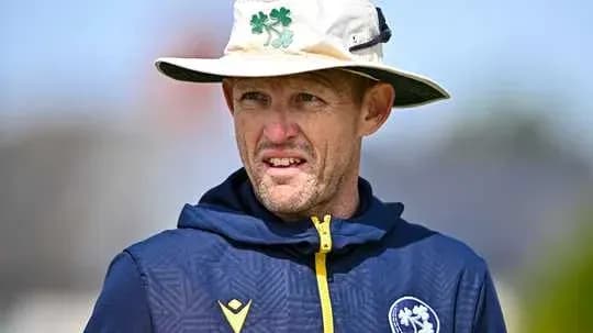 Coach wearing hat during training session Coach wearing hat during training session