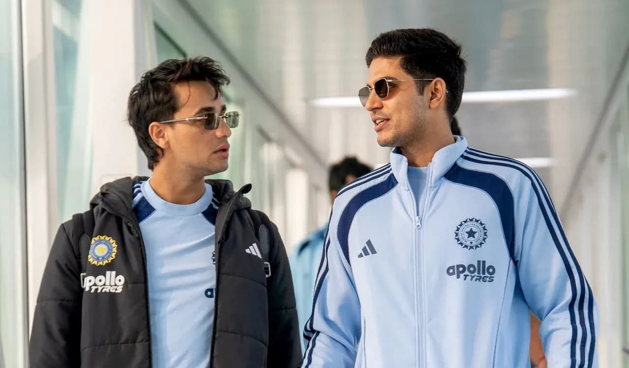 Two players walking in sports attire at venue Two players walking in sports attire at venue