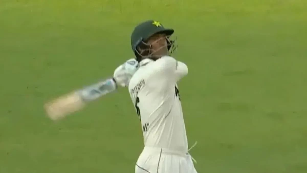 Batsman swinging bat during cricket match Batsman swinging bat during cricket match