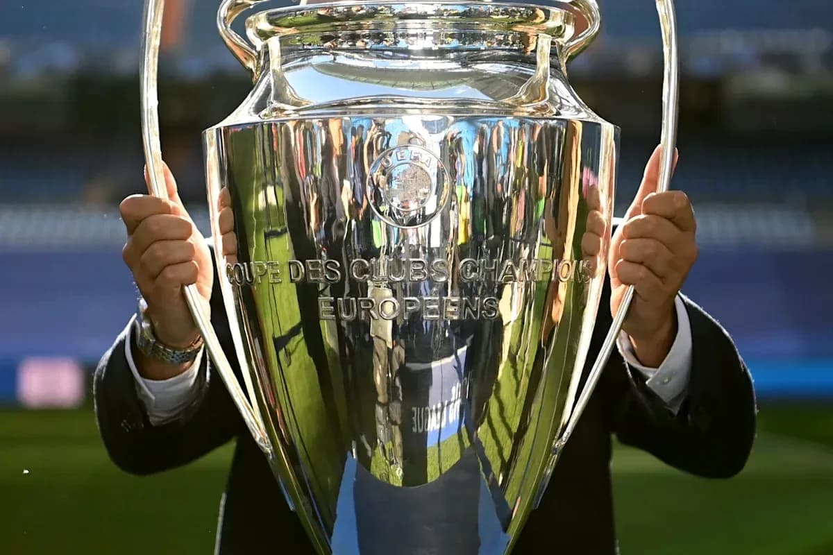 Close-up of UEFA Champions League trophy being held Close-up of UEFA Champions League trophy being held