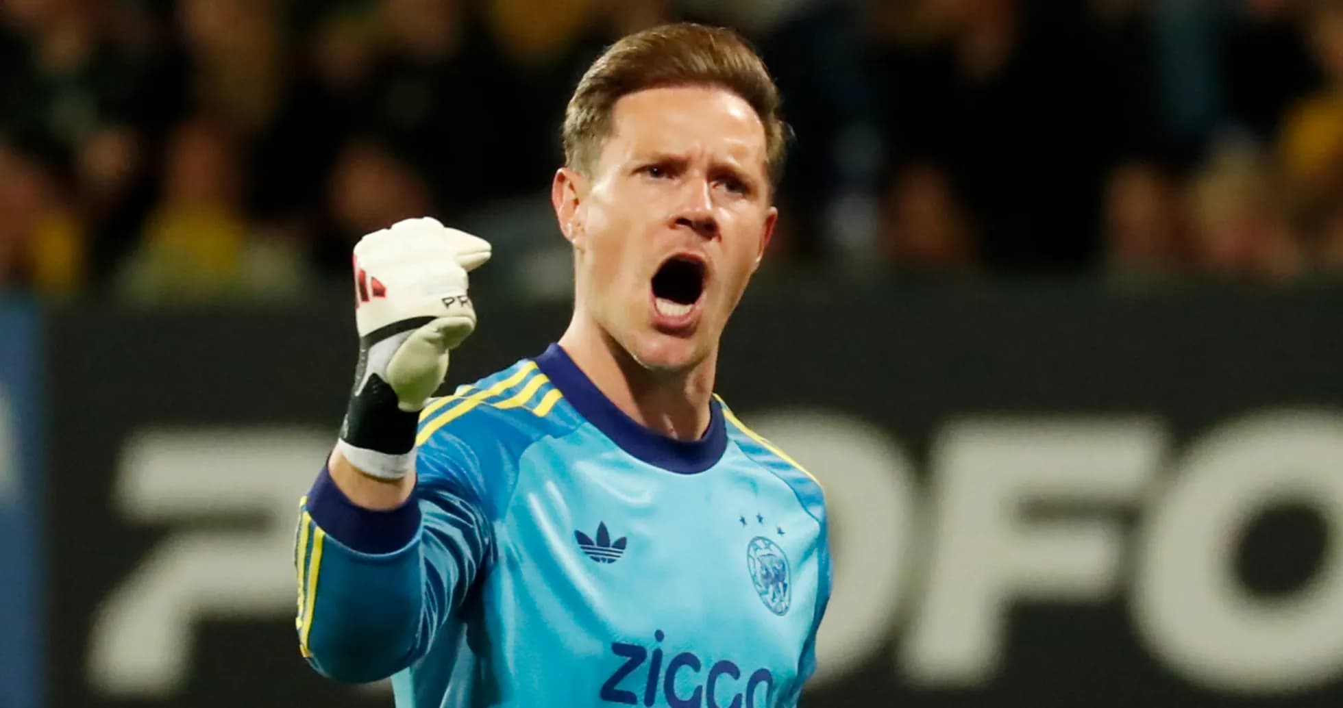 Goalkeeper celebrating a save during a match Goalkeeper celebrating a save during a match