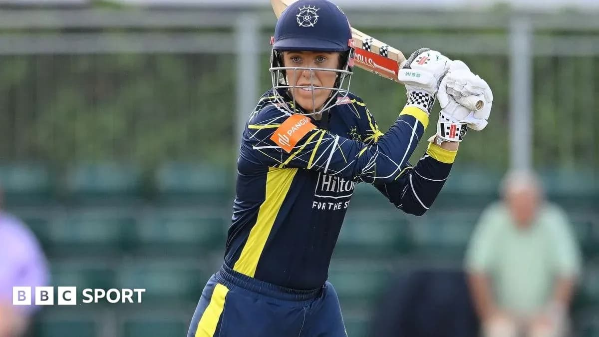 Cricketer preparing to bat during a match Cricketer preparing to bat during a match