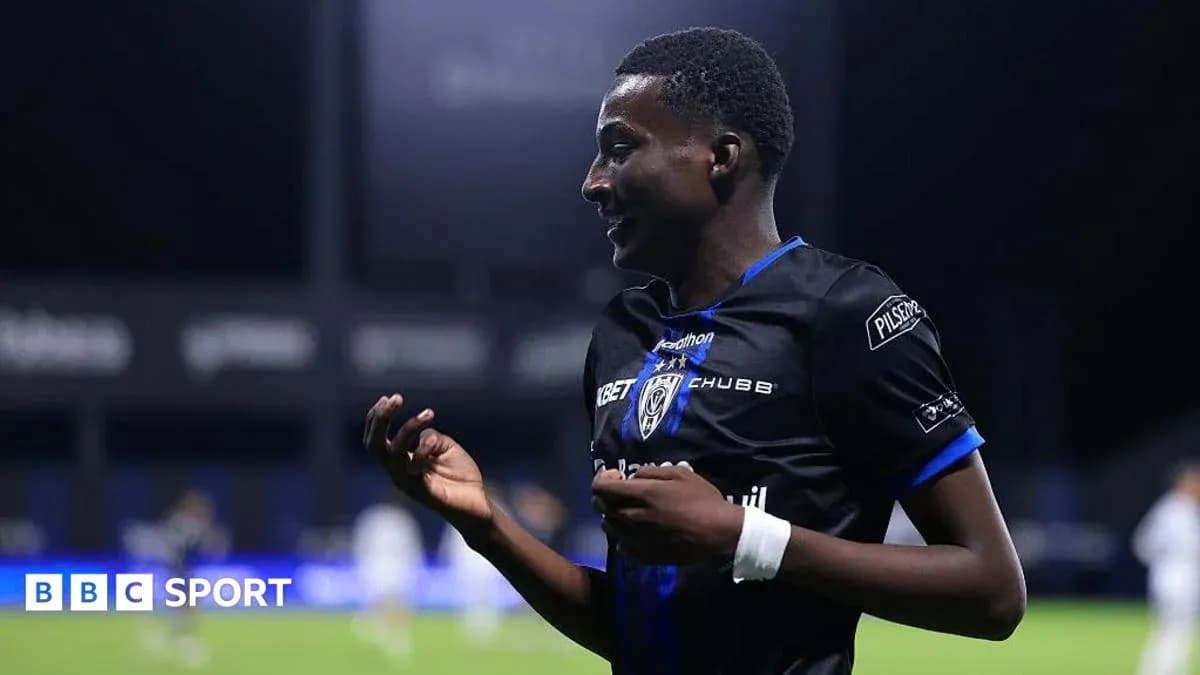 Player celebrating on the pitch after scoring Player celebrating on the pitch after scoring