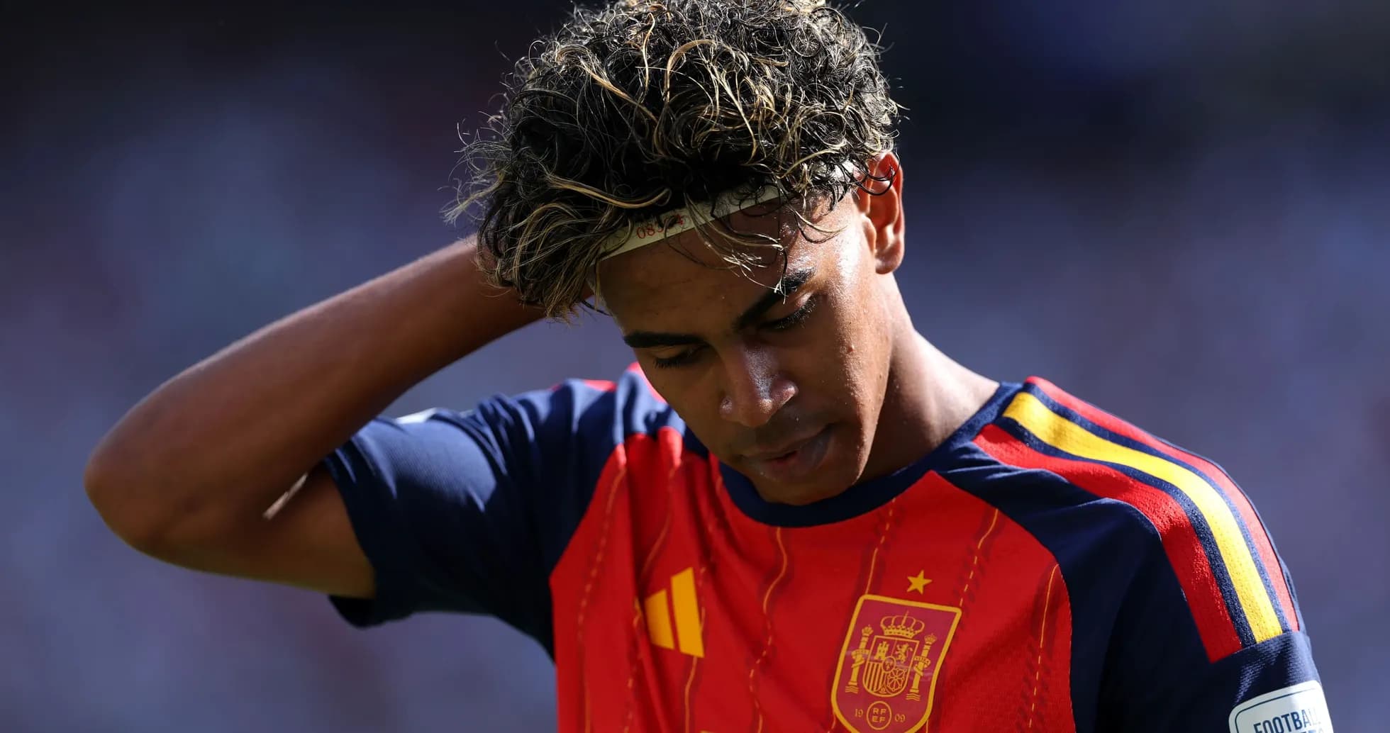 Player in Spain jersey looking down during match Player in Spain jersey looking down during match