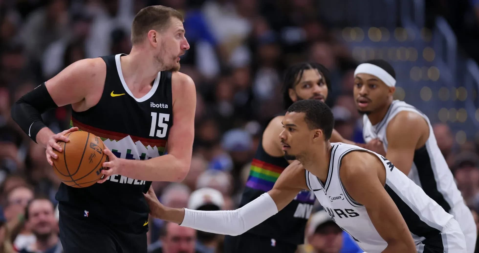 Player dribbling basketball during NBA game action Player dribbling basketball during NBA game action