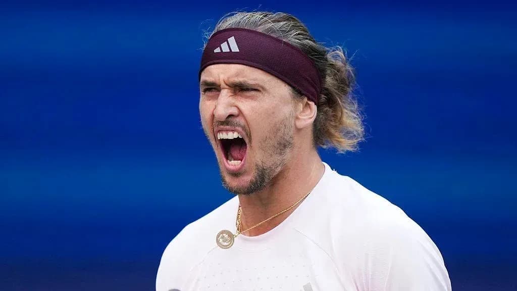 Tennis player celebrating during a match Tennis player celebrating during a match