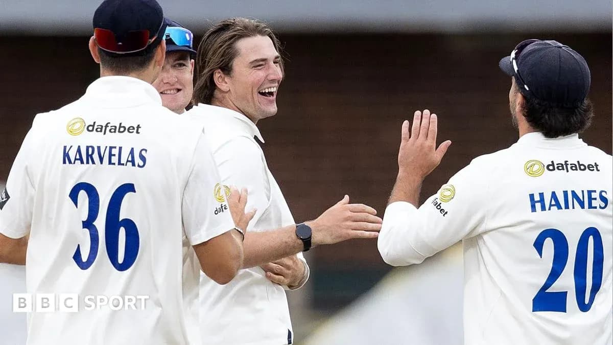 Cricket players celebrating a wicket on the field Cricket players celebrating a wicket on the field