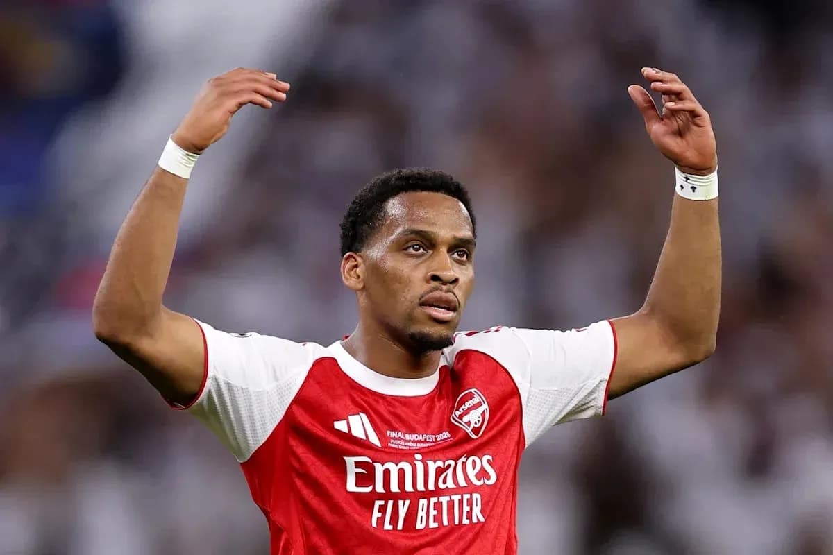 Arsenal player raising arms during match celebration Arsenal player raising arms during match celebration