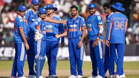 Indian cricket team discussing strategy on field Indian cricket team discussing strategy on field