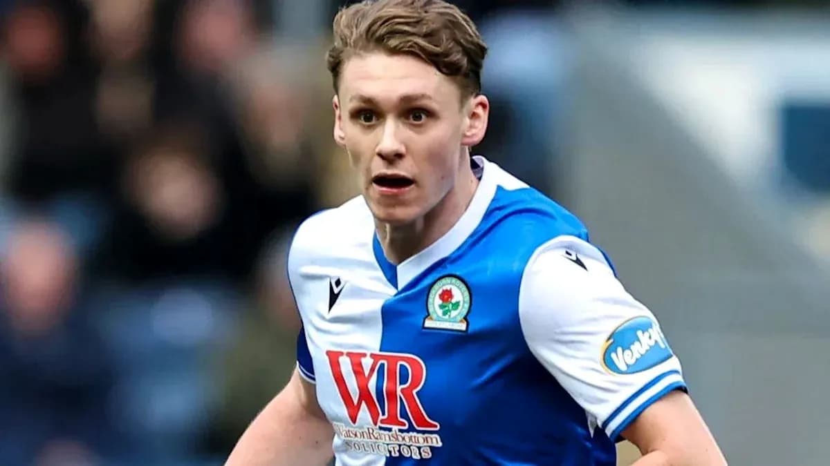 Player running during a football match for Blackburn Rovers Player running during a football match for Blackburn Rovers