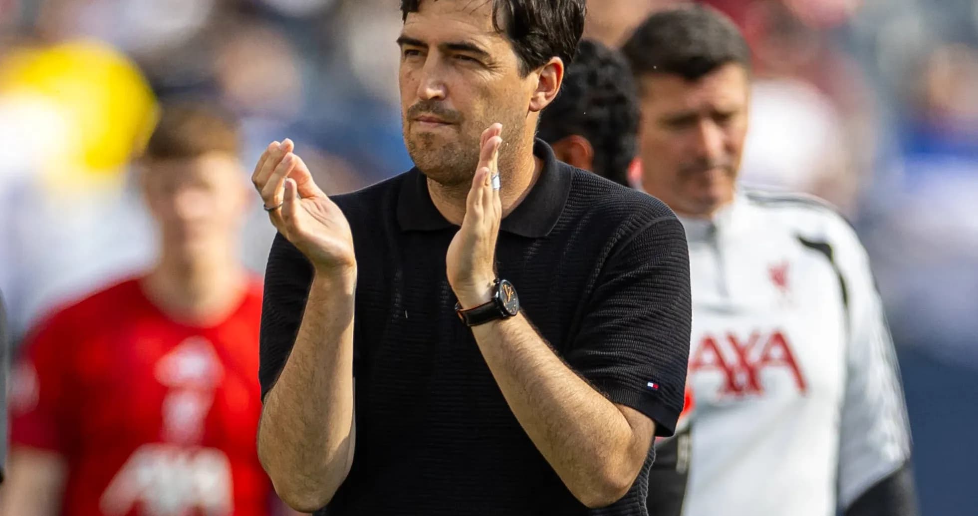 Coach applauding during a match on the sidelines Coach applauding during a match on the sidelines