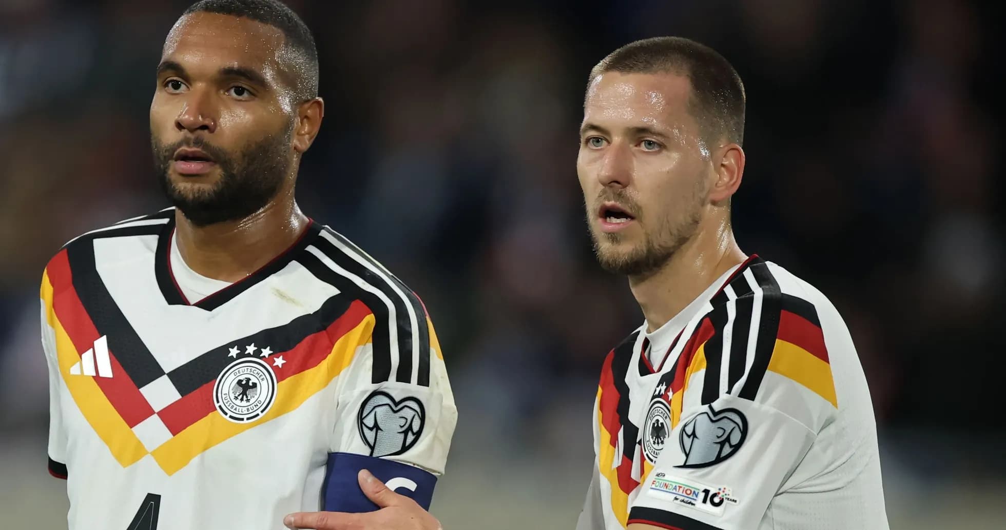 Two German football players during a match Two German football players during a match