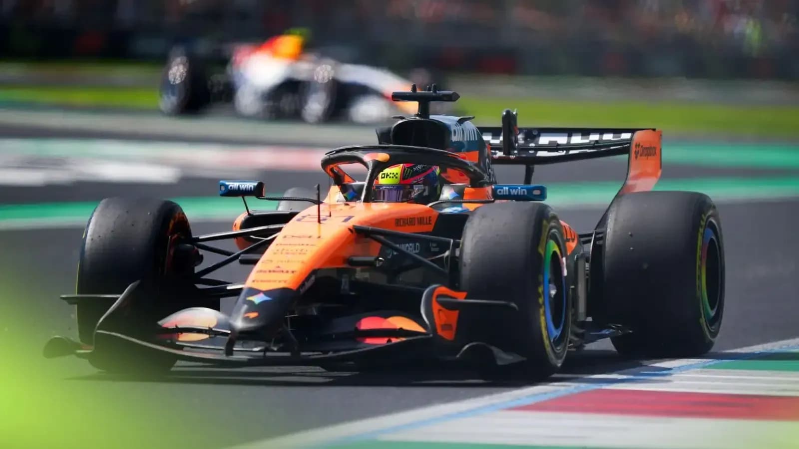 McLaren Formula 1 car racing on track McLaren Formula 1 car racing on track