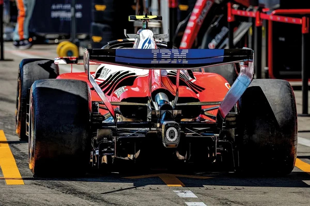 Rear view of a red Formula 1 car in pit lane Rear view of a red Formula 1 car in pit lane