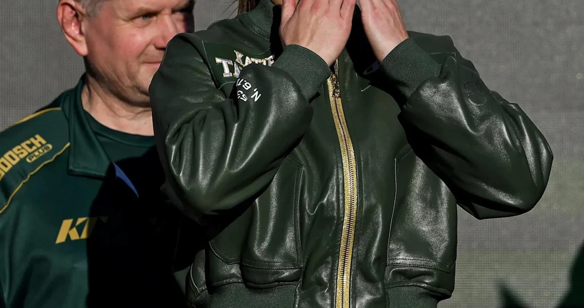 Female boxer blowing kisses at weigh-in event Female boxer blowing kisses at weigh-in event