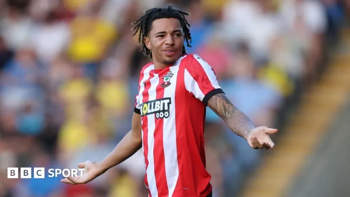 Player gesturing during a football match Player gesturing during a football match