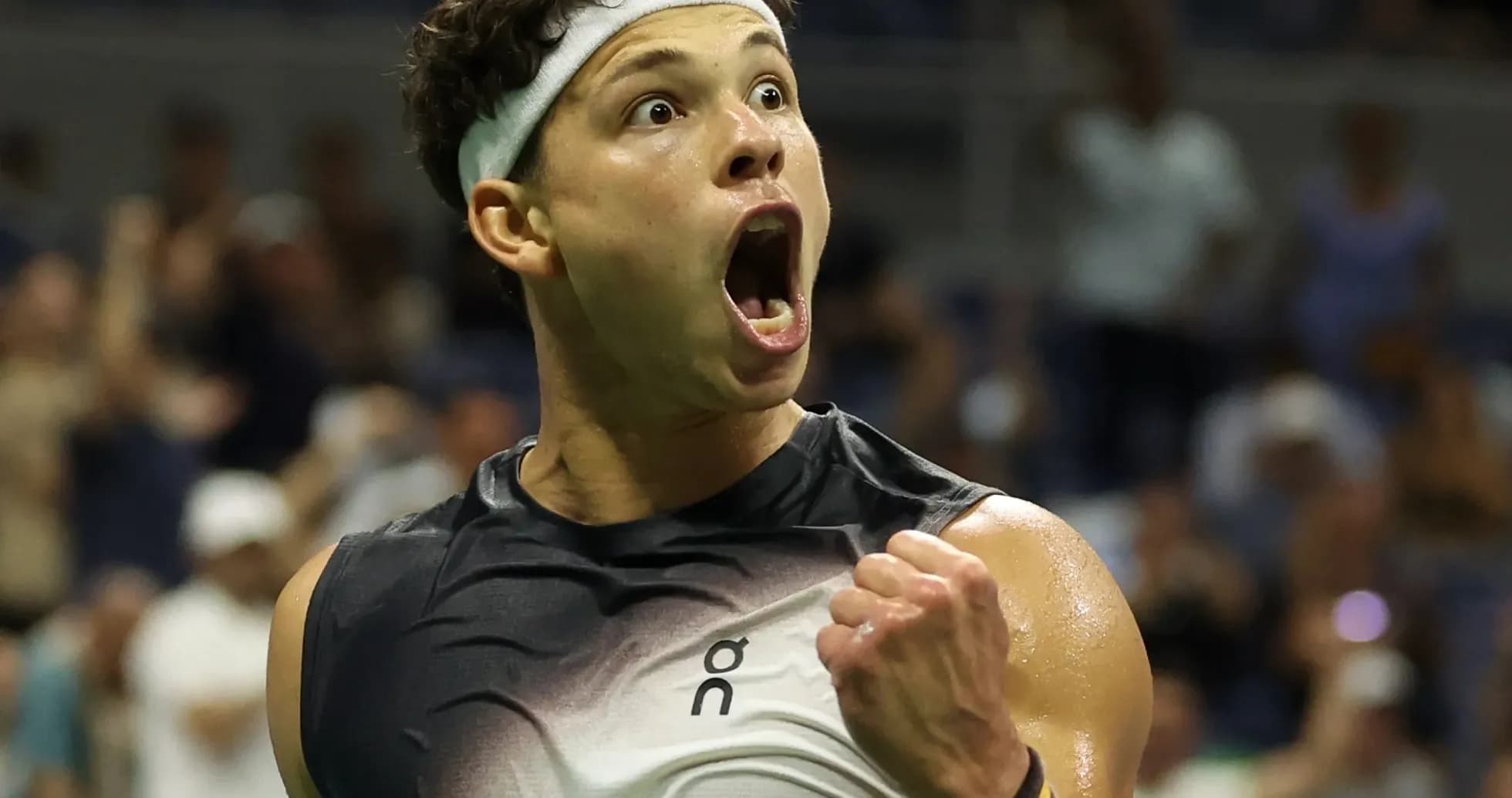 Tennis player celebrating a victory on court Tennis player celebrating a victory on court
