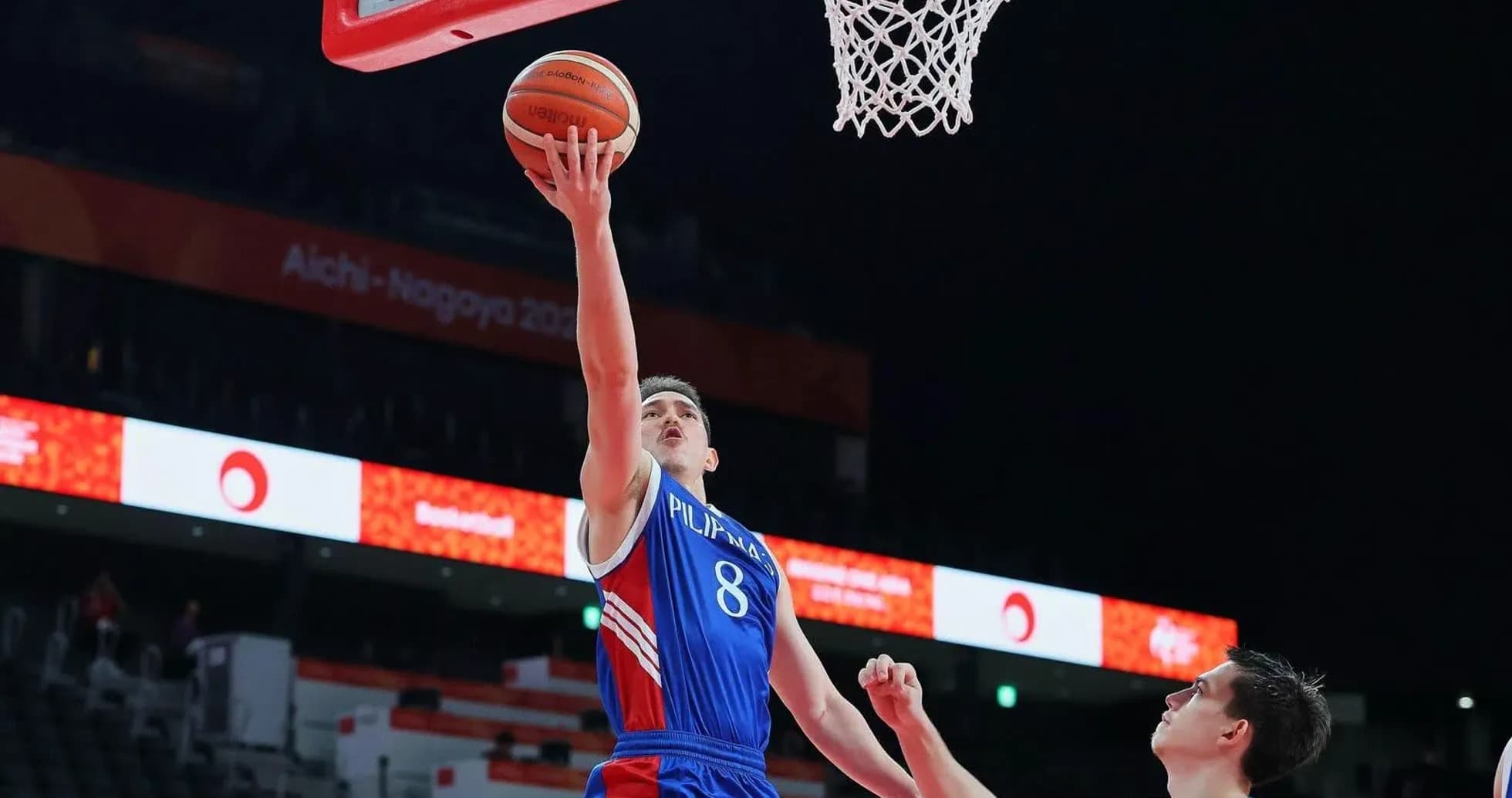 Player shooting a basketball during a game Player shooting a basketball during a game