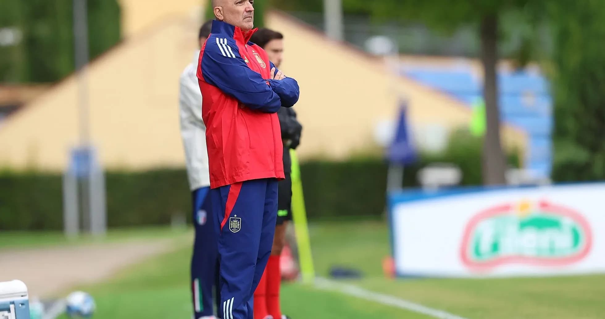 Coach observing training session from the sidelines Coach observing training session from the sidelines