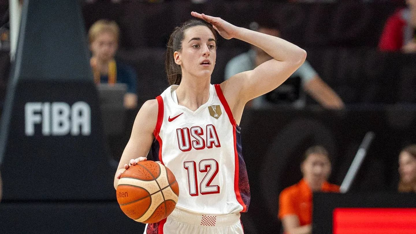 Player with ball gesturing during basketball game Player with ball gesturing during basketball game
