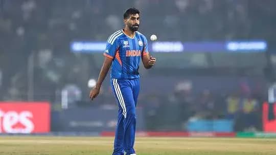 Bowler walking with ball during cricket match Bowler walking with ball during cricket match