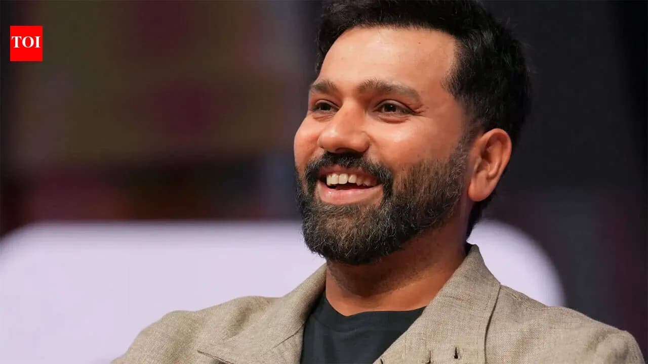 Man smiling during a public speaking event Man smiling during a public speaking event
