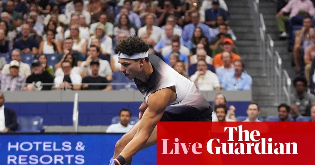 Player serving during a tennis match with crowd behind Player serving during a tennis match with crowd behind