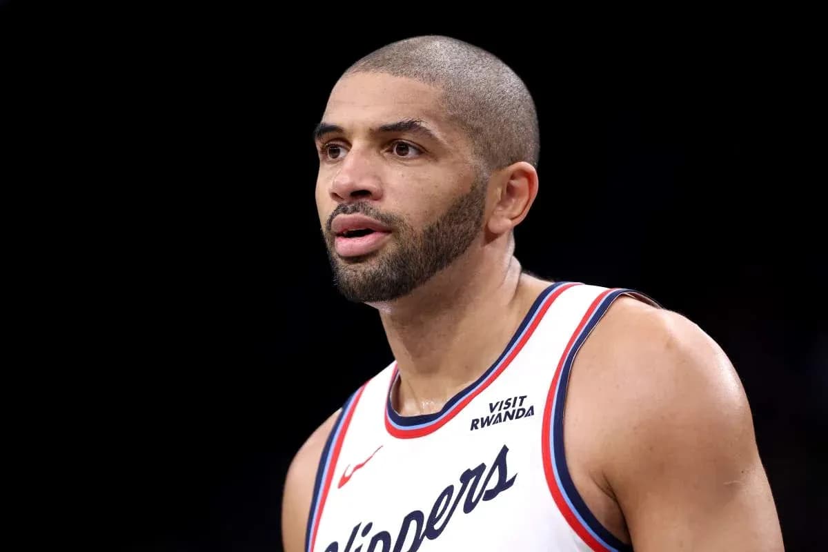 Player in Clippers jersey during game action Player in Clippers jersey during game action