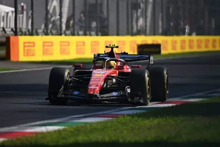 Ferrari car navigating a corner on racetrack Ferrari car navigating a corner on racetrack