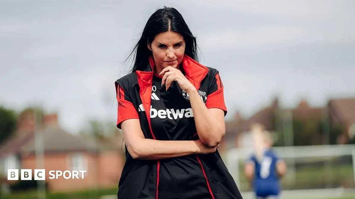 Female coach observing players during training session Female coach observing players during training session