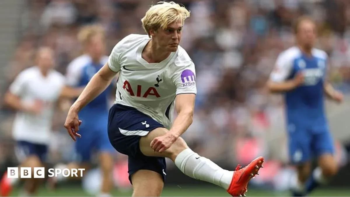 Player kicking the ball during a football match Player kicking the ball during a football match