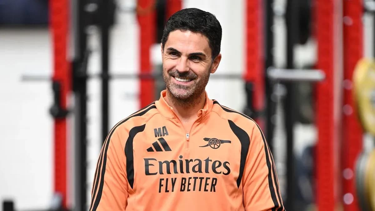 Coach in training gear smiling during session Coach in training gear smiling during session