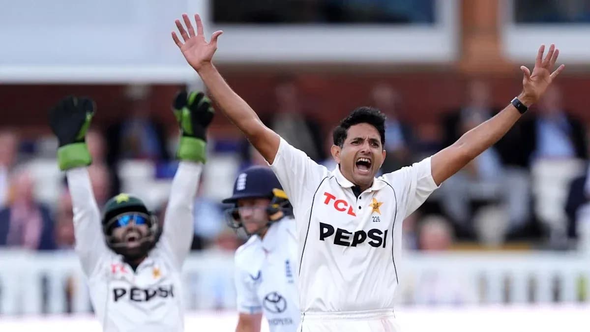 Bowler celebrating a wicket with teammates during match Bowler celebrating a wicket with teammates during match