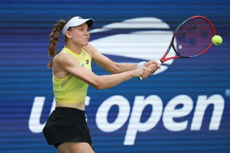 Player hitting a backhand during US Open match Player hitting a backhand during US Open match