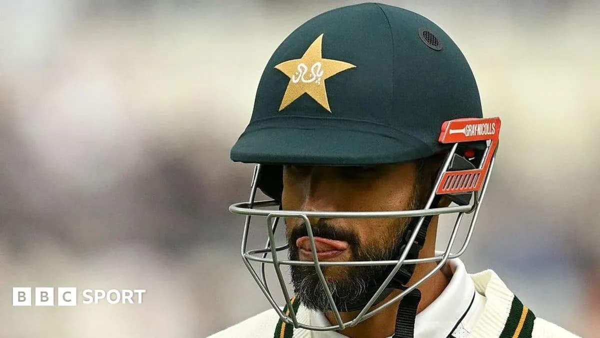Cricketer wearing helmet with Pakistan team logo Cricketer wearing helmet with Pakistan team logo