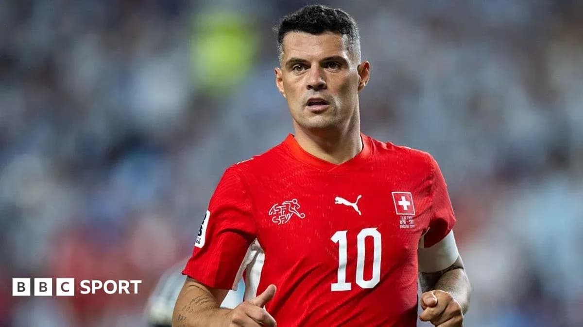 Player in red jersey during football match Player in red jersey during football match