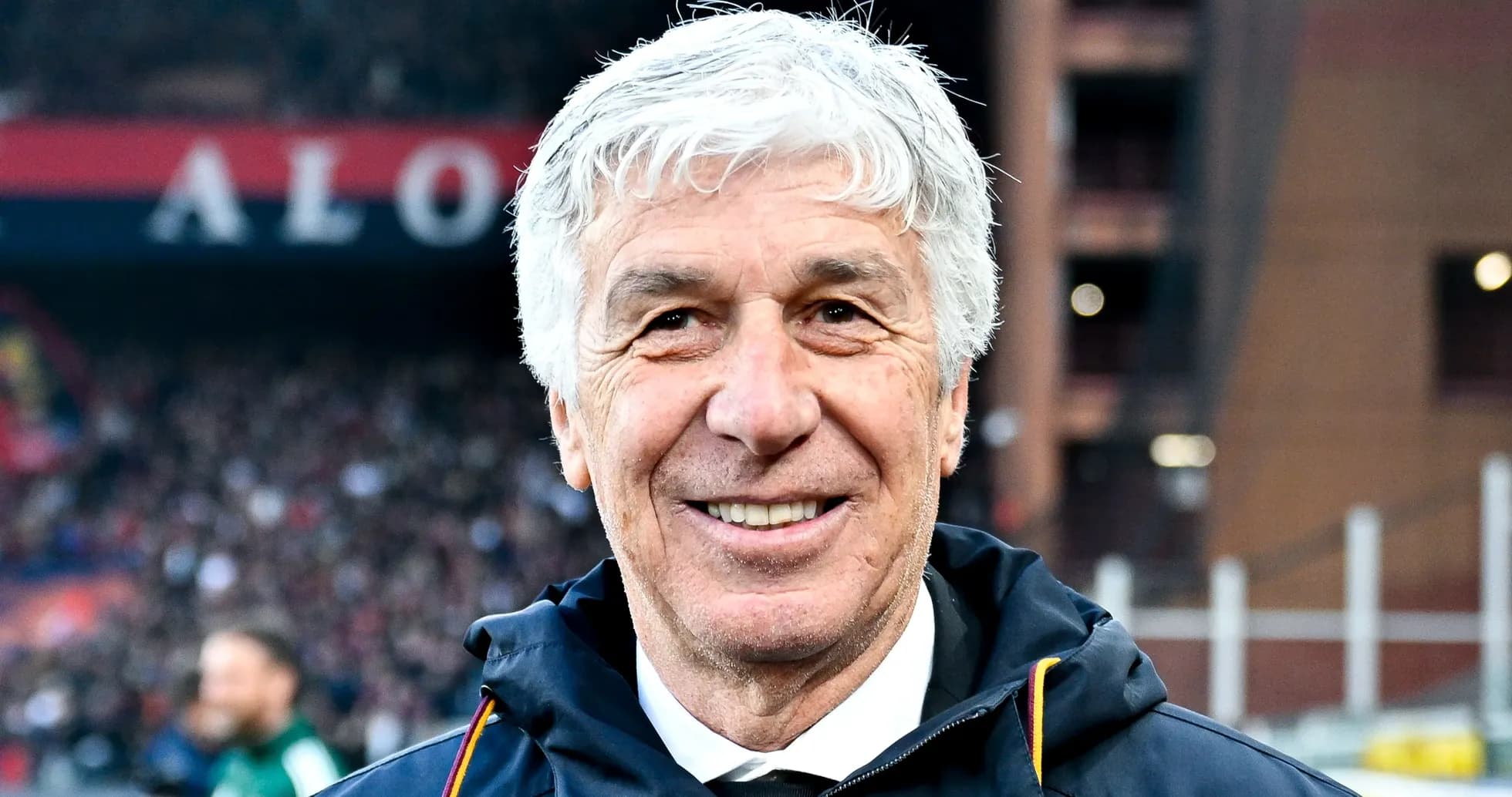 Smiling coach in front of stadium crowd Smiling coach in front of stadium crowd