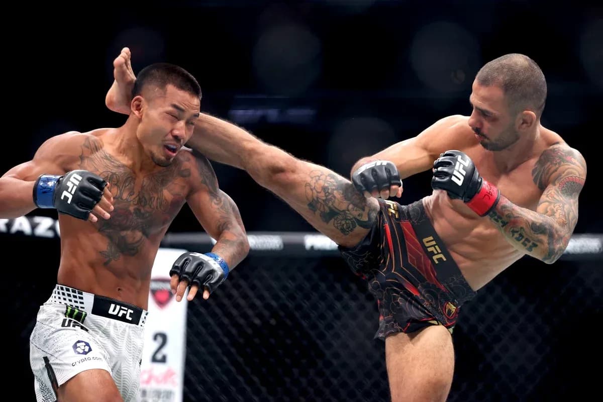 Two fighters engaged in a striking exchange in UFC match Two fighters engaged in a striking exchange in UFC match