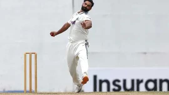 Bowler delivering a ball during cricket match Bowler delivering a ball during cricket match