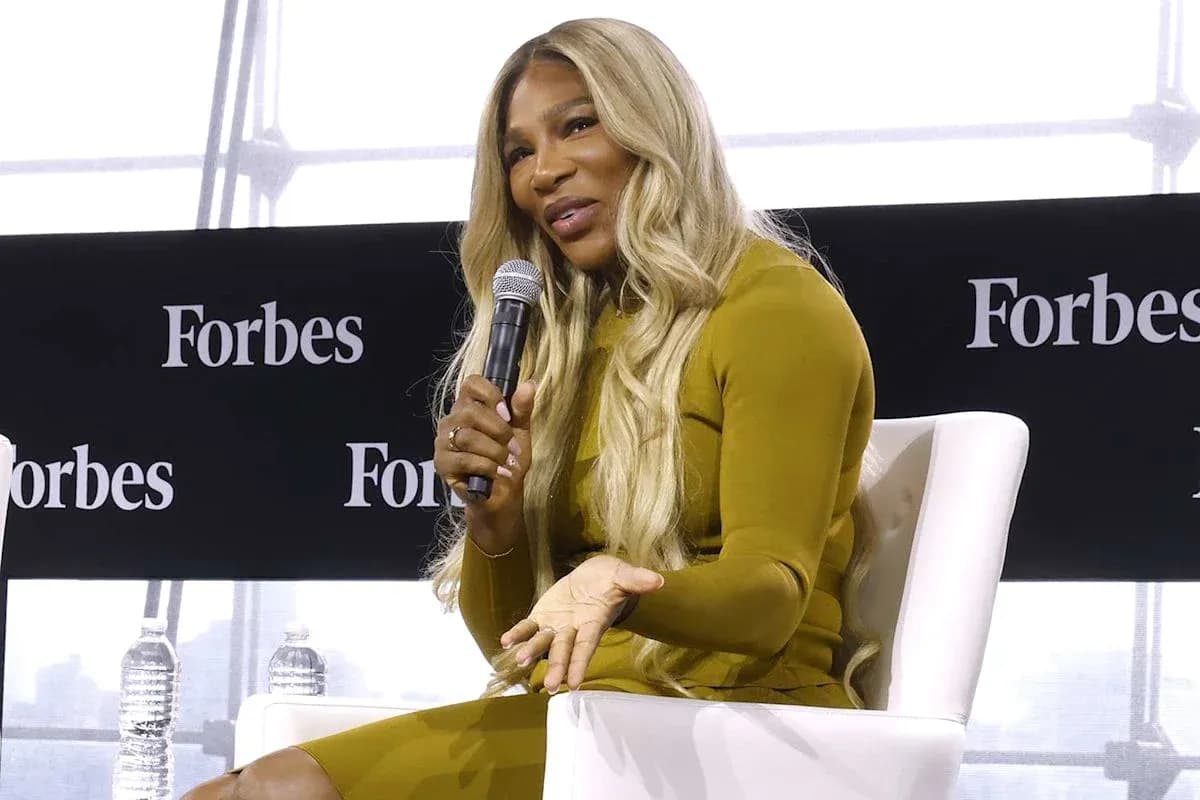 Speaker discussing at Forbes event with microphone Speaker discussing at Forbes event with microphone