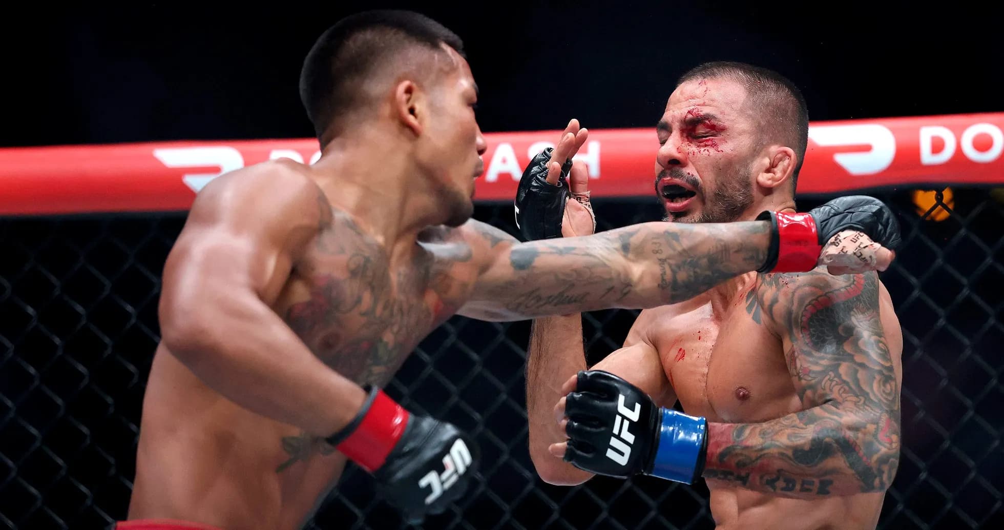 Fighter delivering a punch during an MMA match Fighter delivering a punch during an MMA match