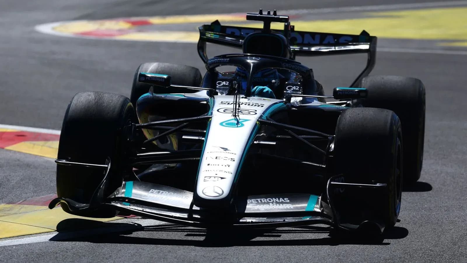 Mercedes Formula 1 car racing on track Mercedes Formula 1 car racing on track